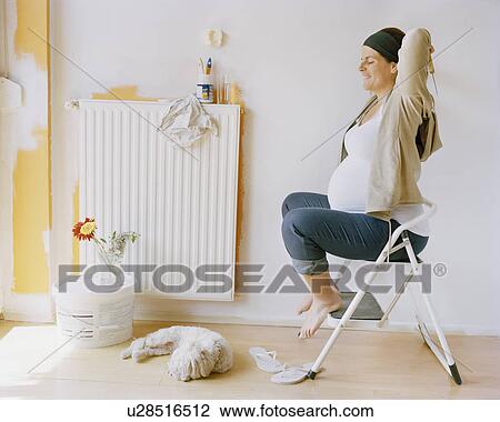 Stock Image - Pregnant woman nesting. Fotosearch
