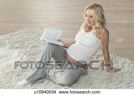 Pregnant woman reading View Large Photo Image Picture - Pregnant woman reading. Fotosearch
