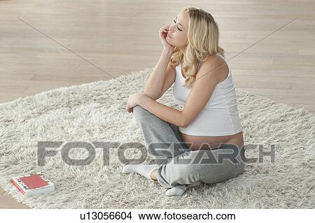 Pregnant woman thinking View Large Photo Image Picture - Pregnant woman thinking. Fotosearch