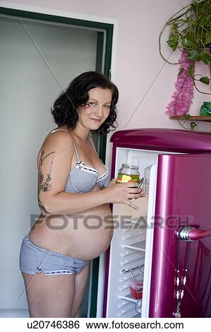Pregnant woman with pickles View Large Photo Image Stock Photograph - Pregnant woman with pickles. Fotosearch