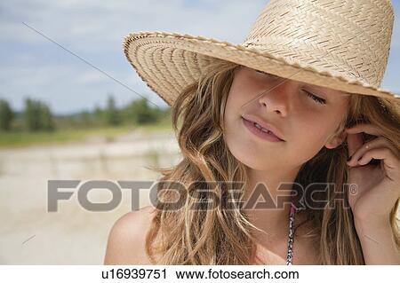 Pretty woman in straw hand daydreaming View Large Photo Image Stock Image - Pretty woman in straw hand daydreaming. Fotosearch