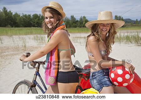 Pretty women happy on the beach View Large Photo Image Stock Photo - Pretty women happy on the beach. Fotosearch