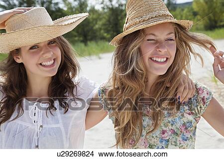 Pretty women smiling together View Large Photo Image Picture - Pretty women smiling together. Fotosearch