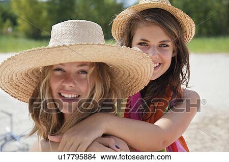 Pretty women together in the sunshine View Large Photo Image Picture - Pretty women together in the sunshine. Fotosearch