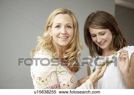 Pride mother with daughter in jewelry View Large Photo Image Stock Photography - Pride mother with daughter in jewelry. Fotosearch