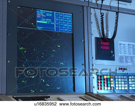 Stock Image - Radar desk in control room. Fotosearch