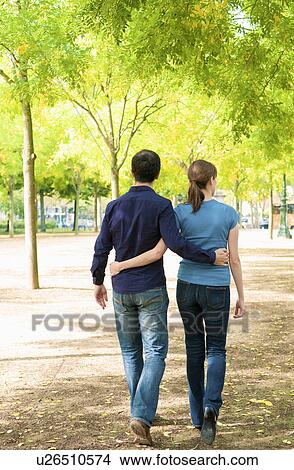 Romantic couple walk thru Paris park View Large Photo Image Picture - Romantic couple walk thru Paris park. Fotosearch