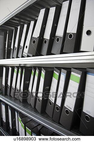 Stock Image - Rows of business files on shelves. Fotosearch