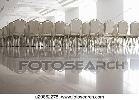 Rows of empty white chairs View Large Photo Image Stock Photography - Rows of empty white chairs. Fotosearch