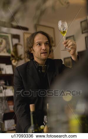 Stock Photograph - Salesman with virgin olive oil. Fotosearch