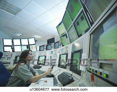 Scientist in accelerator control room View Large Photo Image Stock Photo - Scientist in accelerator control room. Fotosearch