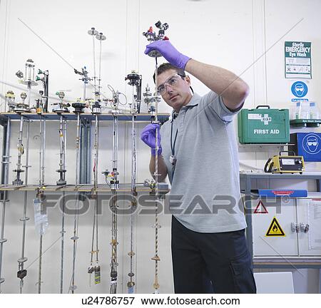 Scientist inspects accelerator probes View Large Photo Image Stock Photo - Scientist inspects accelerator probes. Fotosearch