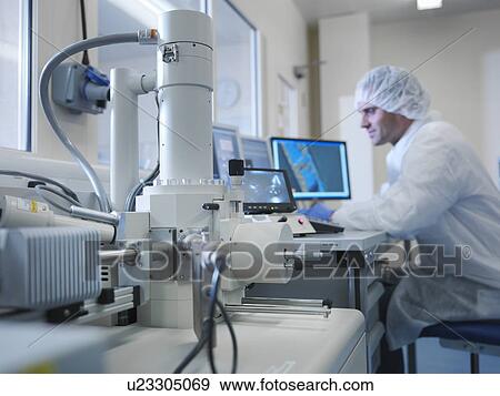 Scientist with electron microscope View Large Photo Image Stock Photo - Scientist with electron microscope. Fotosearch