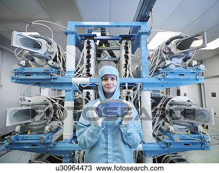 Stock Image - Scientist with filter and laser lens. Fotosearch