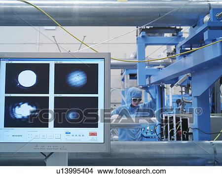 Scientist with laser experiment View Large Photo Image Picture - Scientist with laser experiment. Fotosearch