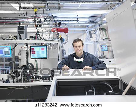 Scientist with laser in laboratory View Large Photo Image Stock Image - Scientist with laser in laboratory. Fotosearch
