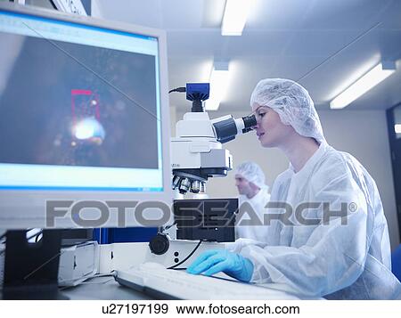 Scientist with microscope View Large Photo Image Stock Photo - Scientist with microscope. Fotosearch