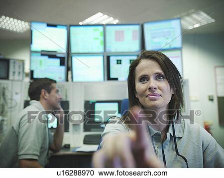 Scientists in accelerator control room View Large Photo Image Stock Image - Scientists in accelerator control room. Fotosearch
