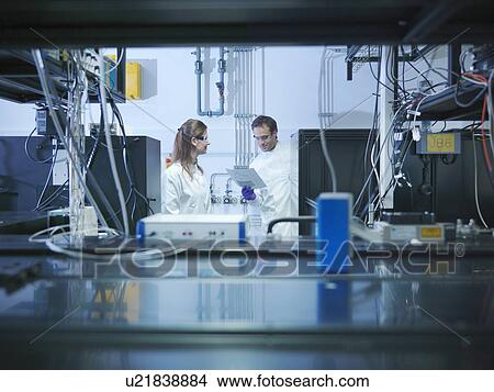 Picture - Scientists in laser laboratory. Fotosearch