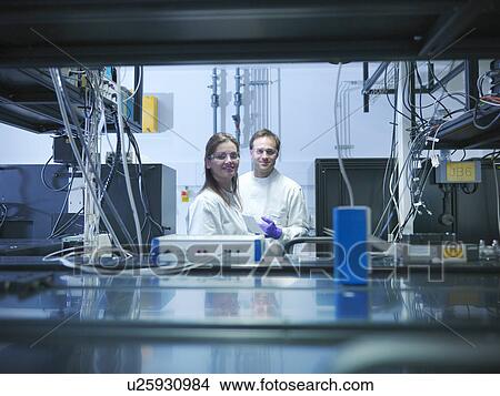Scientists in laser laboratory View Large Photo Image Picture - Scientists in laser laboratory. Fotosearch