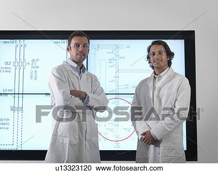 Scientists with diagrams on screen View Large Photo Image Stock Image - Scientists with diagrams on screen. Fotosearch