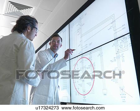 Scientists with diagrams on screen View Large Photo Image Stock Image - Scientists with diagrams on screen. Fotosearch