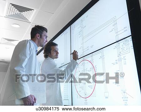 Scientists with diagrams on screen View Large Photo Image Stock Photography - Scientists with diagrams on screen. Fotosearch