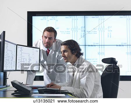 Scientists with diagrams on screens View Large Photo Image Stock Image - Scientists with diagrams on screens. Fotosearch