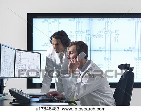 Scientists with diagrams on screens View Large Photo Image Stock Image - Scientists with diagrams on screens. Fotosearch