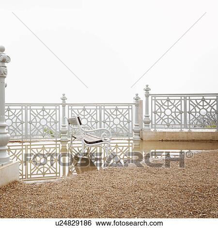 Stock Photograph - Seat in a puddle. Fotosearch