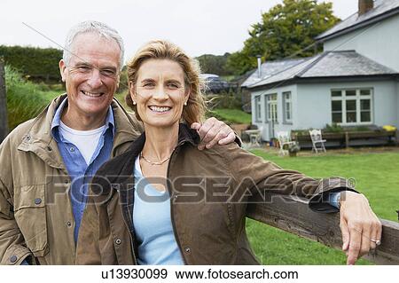 Stock Photo - Seniors together on farm. Fotosearch