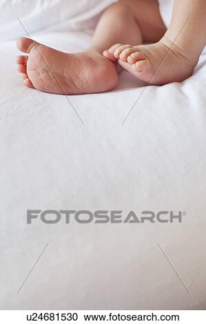 Small babies feet above large copy space View Large Photo Image Stock Image - Small babies feet above large copy space. Fotosearch