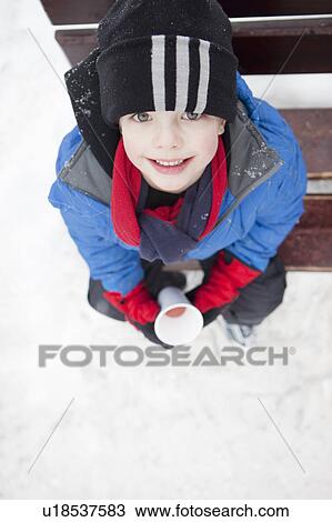 Smiling boy on a cold winter day View Large Photo Image Stock Image - Smiling boy on a cold winter day. Fotosearch