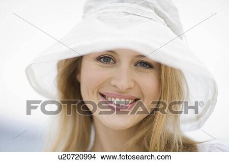 Smiling woman with hat View Large Photo Image Picture - Smiling woman with hat. Fotosearch