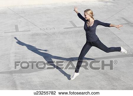 Smiling women jumping View Large Photo Image Stock Image - Smiling women jumping. Fotosearch