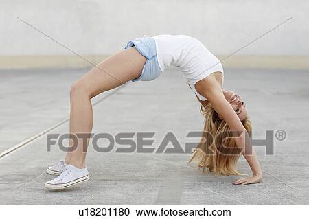 Smiling women stretching View Large Photo Image Stock Image - Smiling women stretching. Fotosearch