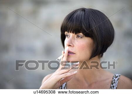 Smoking woman View Large Photo Image Stock Photo - Smoking woman. Fotosearch