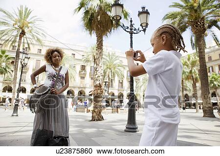 Son taking a picture of mom View Large Photo Image Stock Image - Son taking a picture of mom. Fotosearch