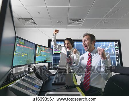 Stock Photo - Successful financial trader and screens. Fotosearch