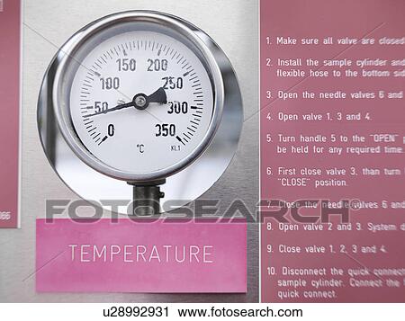 Stock Image - Temperature gauge at gas storage plant. Fotosearch