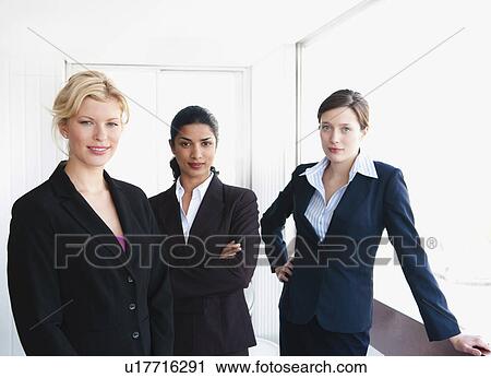 Stock Image - Three business women in office. Fotosearch