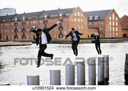 Three businesspeople jumping View Large Photo Image Picture - Three businesspeople jumping. Fotosearch