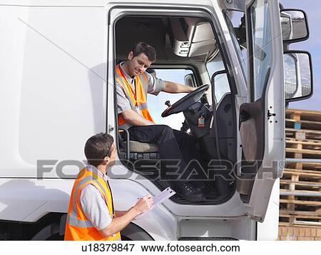 Stock Photo - Truck driver and dispatch worker talk. Fotosearch