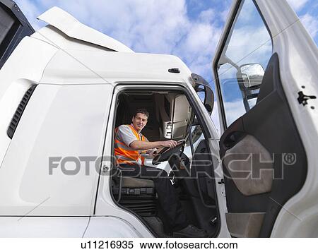 Truck driver looks down from truck View Large Photo Image Stock Photography - Truck driver looks down from truck. Fotosearch