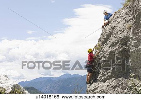 Two boys climbing View Large Photo Image Stock Photography - Two boys climbing. Fotosearch