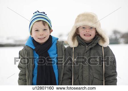 Two boys out in the snow View Large Photo Image Stock Image - Two boys out in the snow. Fotosearch