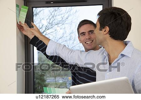 Two developers in their new apartment View Large Photo Image Stock Photography - Two developers in their new apartment. Fotosearch