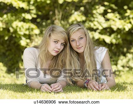 Two girls in the park View Large Photo Image Stock Photograph - Two girls in the park. Fotosearch