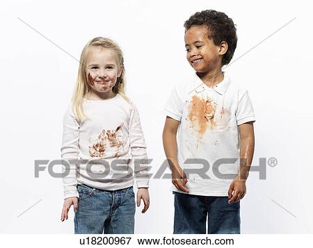 Two kids covered in chocolate sauce View Large Photo Image Stock Photo - Two kids covered in chocolate sauce. Fotosearch