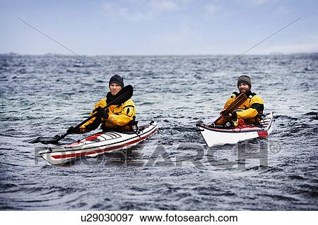 Two men kayaking View Large Photo Image Stock Photo - Two men kayaking. Fotosearch